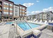 Thumbnail 44 of 59 - our apartments have a large swimming pool in front of our buildings at The Quarry Luxury Apartment Homes, Fort Collins, CO, 80526