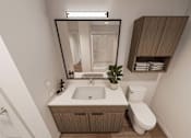 Thumbnail 22 of 32 - A bathroom with a white sink and a white toilet.