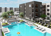 Thumbnail 9 of 21 - A pool surrounded by lounge chairs and umbrellas is the centerpiece of a resort-style courtyard at Refinery at Pointe17 Apartments, Phoenix, AZ, 85085