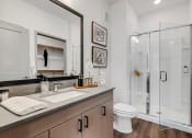 Thumbnail 12 of 31 - a bathroom with a toilet sink and shower  at Prism at Diamond Ridge, Pennsylvania, 15108