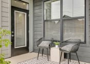 Thumbnail 21 of 31 - a patio with two chairs and a small table  at Prism at Diamond Ridge, Moon Township, PA, 15108