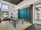 Thumbnail 29 of 31 - a spacious living room with a pool table in the middle of the room  at Prism at Diamond Ridge, Moon Township, Pennsylvania