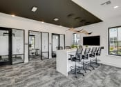 Thumbnail 26 of 31 - an open concept office with a white reception desk and black ceiling  at Prism at Diamond Ridge, Moon Township