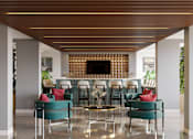 Thumbnail 15 of 21 - A modern living room with a fireplace and comfortable seating at Refinery at Pointe17 Apartments, Phoenix, Arizona