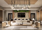 Thumbnail 10 of 48 - A modern living room with a white sofa set and a green plant on the fireplace.