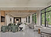 Thumbnail 5 of 32 - A spacious living room with a variety of seating options and a view of the outdoors.