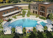 Thumbnail 15 of 21 - A large building with a pool in front of it.