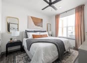Thumbnail 18 of 56 - a bedroom with a bed and a ceiling fan at Notch66, Longmont, Colorado