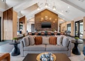 Thumbnail 34 of 56 - a living room with a couch and a table at Notch66, Longmont, Colorado