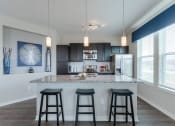 Thumbnail 4 of 40 - Island Kitchen at Watermark on Twenty Mile, Parker