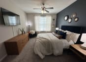 Thumbnail 39 of 56 - a bedroom with a large bed at Watermark at Steele Crossing, Arkansas, 72703