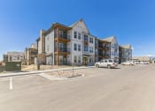 Thumbnail 36 of 38 - a large building with a parking lot in front of it  at Upland Flats, Colorado Springs, Colorado