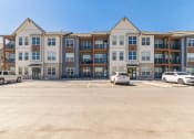 Thumbnail 35 of 38 - a large parking lot in front of an apartment building  at Upland Flats, Colorado Springs, 80922