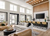 Thumbnail 55 of 58 - a living room with a couch and a bar and a television at Palm Grove in Ellenton, FL 34222