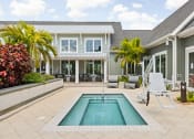 Thumbnail 29 of 58 - a backyard with a pool and a house at Palm Grove in Ellenton, FL 34222