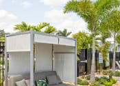Thumbnail 28 of 58 - a patio with a couch and a canopy at Palm Grove in Ellenton, FL 34222