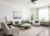 Thumbnail 13 of 58 - a living room with a green couch and chairs and a ceiling fan at Palm Grove in Ellenton, FL 34222