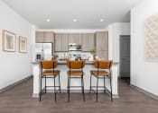 Thumbnail 8 of 58 - a kitchen with a bar at Palm Grove in Ellenton, FL 34222
