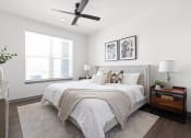 Thumbnail 19 of 58 - a bedroom with a large bed and a ceiling fan at Palm Grove in Ellenton, FL 34222