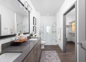 Thumbnail 18 of 58 - a bathroom with a shower and a sink and a mirror at Palm Grove in Ellenton, FL 34222