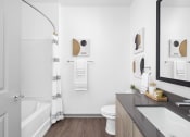Thumbnail 17 of 58 - a bathroom with a shower and a sink and a toilet at Palm Grove in Ellenton, FL 34222