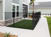 Thumbnail 2 of 58 - a house with a sidewalk and a palm tree in front of it at Palm Grove in Ellenton, FL 34222