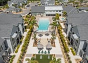 Thumbnail 1 of 58 - an aerial view of a swimming pool in a row of houses at Palm Grove in Ellenton, FL 34222