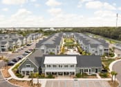 Thumbnail 36 of 58 - an aerial view of a large group of houses in a parking lot at Palm Grove in Ellenton, FL 34222