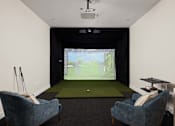 Thumbnail 5 of 60 - A room with a screen and two chairs.