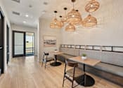 Thumbnail 21 of 60 - A modern dining area with a wooden table and chairs.