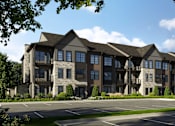 Thumbnail 4 of 4 - A large, modern building with a parking lot in front.