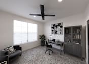 Thumbnail 22 of 31 - A room with a black couch, a desk, and a ceiling fan.