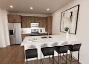 Thumbnail 26 of 31 - A modern kitchen with a white countertop and black chairs.