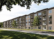 Thumbnail 3 of 4 - A row of modern apartment buildings with trees in the foreground.