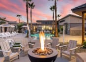 Thumbnail 2 of 68 - Pool with fireplace at sunset at Granstone  at Grandstone at Sunrise, Peoria, AZ