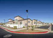 Thumbnail 59 of 68 - a row of houses with a street in front of them at Grandstone at Sunrise, Peoria, AZ