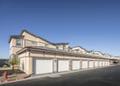 Thumbnail 52 of 68 - a row of houses with garages and a fire hydrant at Grandstone at Sunrise, Peoria, AZ