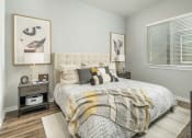Thumbnail 63 of 68 - a bedroom with a bed and a window at Grandstone at Sunrise, Peoria, AZ