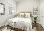 Thumbnail 62 of 68 - a bedroom with a bed and a window at Grandstone at Sunrise, Peoria, AZ