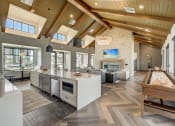 Thumbnail 15 of 46 - a large kitchen and living room with a fireplace at Alta25, Monument, CO