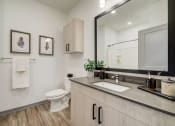 Thumbnail 6 of 46 - a bathroom with a sink and a toilet and a mirror at Alta25, Colorado, 80132