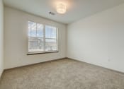 Thumbnail 38 of 46 - the living room of an empty house with a window at Alta25, Colorado, 80132