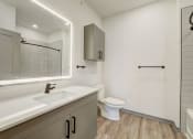 Thumbnail 39 of 46 - a bathroom with a sink and a toilet and a mirror at Alta25, Colorado, 80132