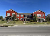 Thumbnail 51 of 56 - a red house on the side of a street at Watermark at Steele Crossing, Arkansas, 72703