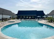 Thumbnail 2 of 45 - a large swimming pool with a building in the background at The BLVD at Wilson Crossings, Michigan, 49418