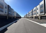 Thumbnail 16 of 58 - a row of apartment buildings on the side of a street at Meridian at CityPlace, Woodbury, 55125
