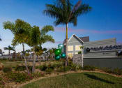 Thumbnail 5 of 58 - a building with palm trees and balloons in front of it  at Palm Grove, Ellenton