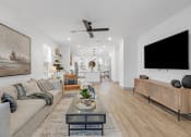 Thumbnail 24 of 58 - a living room with a couch and a tv at Meridian at CityPlace, Woodbury
