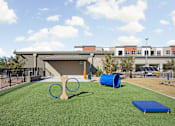 Thumbnail 44 of 108 - our apartments have a playground with a tennis racket and cones at The Maddox Luxury Apartment Homes, Buckeye
