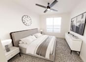 Thumbnail 20 of 21 - A bedroom with a bed, nightstand, and a ceiling fan.